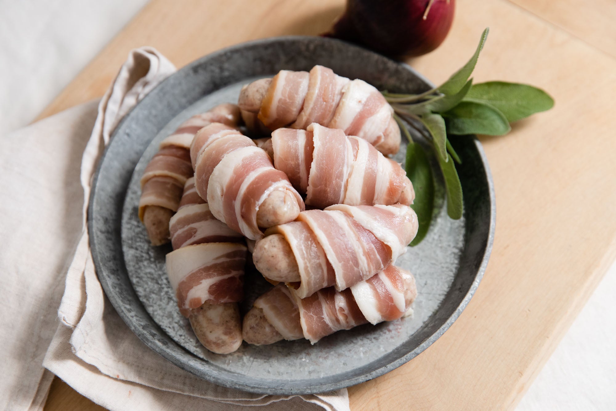 Sage and red onion pigs in blankets